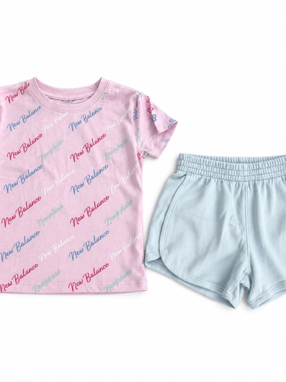 New Balance Girls' Pink Logo Tee and Light Blue Shorts matching set size 10